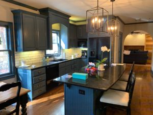 Kitchen island and cabinets painted navy blue